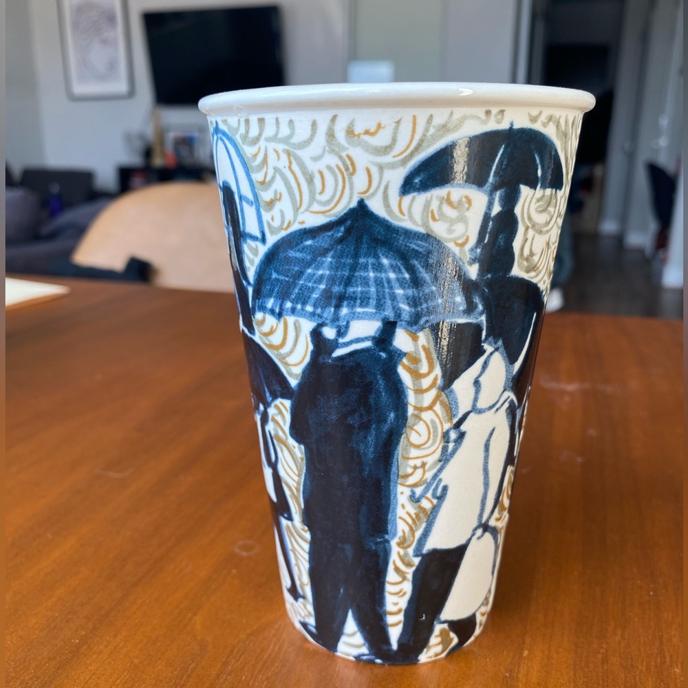 ~2010 Anthropologie painted ceramic cup - rain and people with umbrellas